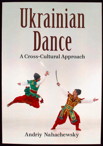White book cover with a colour  photograph  of two dancers in traditional clothing dancing with sabers.